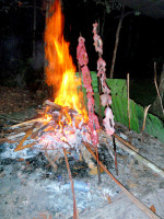 Camp fire dinner on the banks of the Carrao River, Canaima national park, Venezuela Camp fire dinner on the banks of the Carrao River, Canaima national park, Venezuela