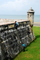 Invasion! Local kids scale the ramparts in Cartagena, Colombia Invasion! Local kids scale the ramparts in Cartagena, Colombia