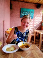 Christi braves the texture-challenging fufu and okra goat stew, Akwamufie Spot restaurant, Accra, Ghana
