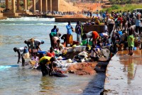 Hard at work, laundry day, Senegal River, Kayes, Mali, Africa Hard at work, laundry day, Senegal River, Kayes, Mali, Africa