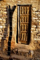 Decorative ladder and decorative door, village of Begnemato, Dogon Country, Mali, Africa Decorative ladder and decorative door, village of Begnemato, Dogon Country, Mali, Africa