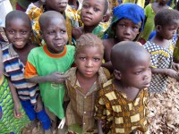 Curious children gather to watch us eat lunch, somewhere in Burkina Faso, Africa Curious children gather to watch us eat lunch, somewhere in Burkina Faso, Africa
