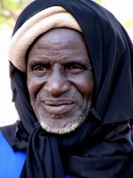 Village elder watches proceedings, Burkina Faso, Africa Village elder watches proceedings, Burkina Faso, Africa
