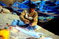 Repairing the fishing nets, Essaouira harbor, Morocco, Africa