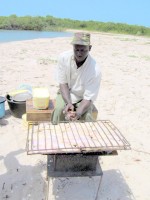 Barbequed lotte au curry for lunch, Sine-Saloum Delta, Senegal, Africa Barbequed lotte au curry for lunch, Sine-Saloum Delta, Senegal, Africa