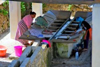 Laundering clothes at an open-air wash house, Ras el-Maa, Chefchaouen, Morocco, Africa