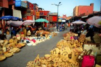 The sea of tourist souvenirs parts briefly to allow people to reach the Promised Land, Marrakesh souq, Morocco, Africa
