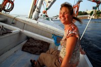 A windswept Christi aboard the felucca, 'Michael Palin', Aswan, Egypt, Africa