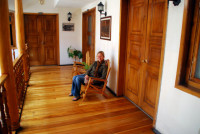 Christi sits outside our room at the hostel in Cuenca