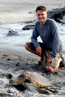 Rod and a pacific green sea turtle, Santiago Island, Galapagos Islands, Ecuador