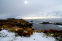 Sun pokes through the storm clouds, Cape Horn, Tierra del Fuego, Chile