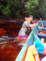 Pushing our boat up the Carrao River, Canaima national park, Venezuela