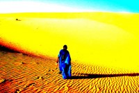A Tuareg nomad and the Sahara Desert near Timbuktu (an artistic rendering), Mali, Africa