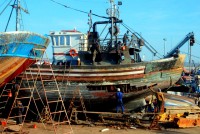 Fishing boat repairs, Essaouira harbor, Morocco, Africa