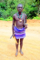 Banna warrior with axe and semi-automatic weapon, Lower Omo Valley, Ethiopia, Africa