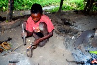 Apprentice blacksmith, Ari village of Rocky, near Jinka, Lower Omo Valley, Ethiopia, Africa